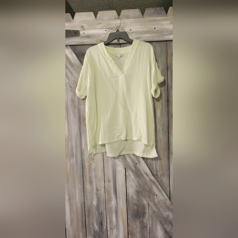 Light green blouse beautiful and fits loose around waist line.